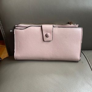 Classic pink leather wallet with amply card space and zipper